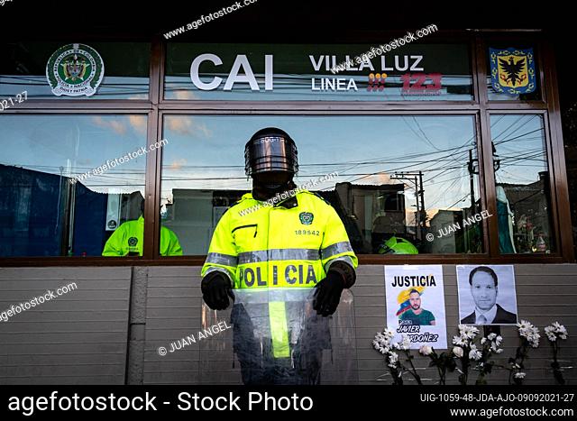 Signs with photos of Javier Ordoñez and flowers as the Villa Luz CAI police station were police officers tortured Javier Ordoñez on September 9, 2020