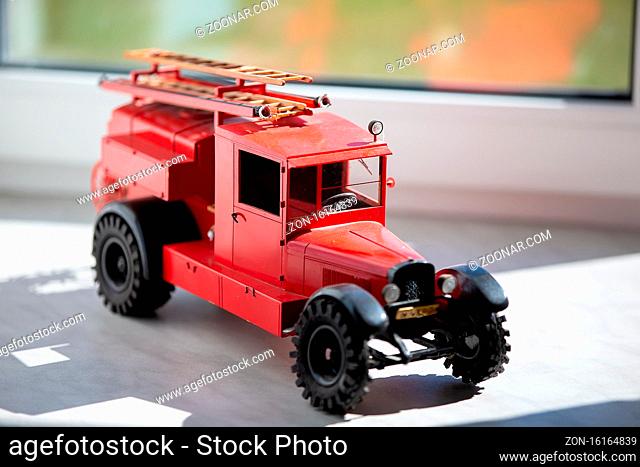 Toy retro fire truck of red color