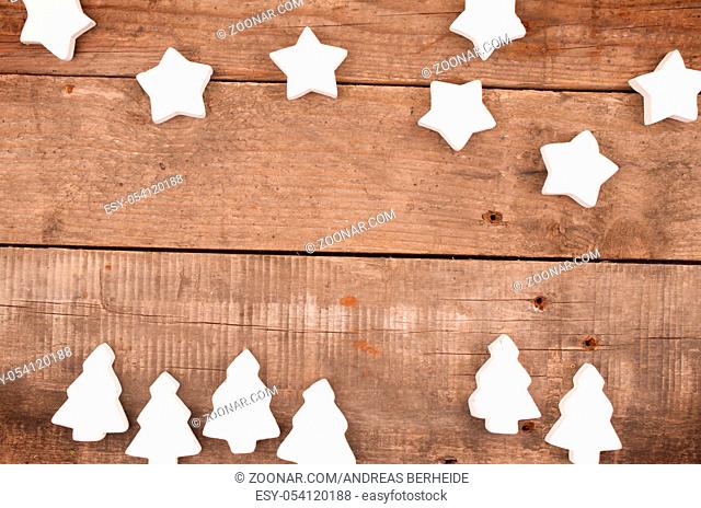Wooden Christmas background with stars and trees