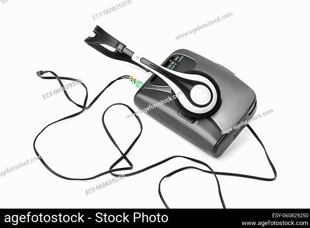 Old cassette player and headphones isolated on white background