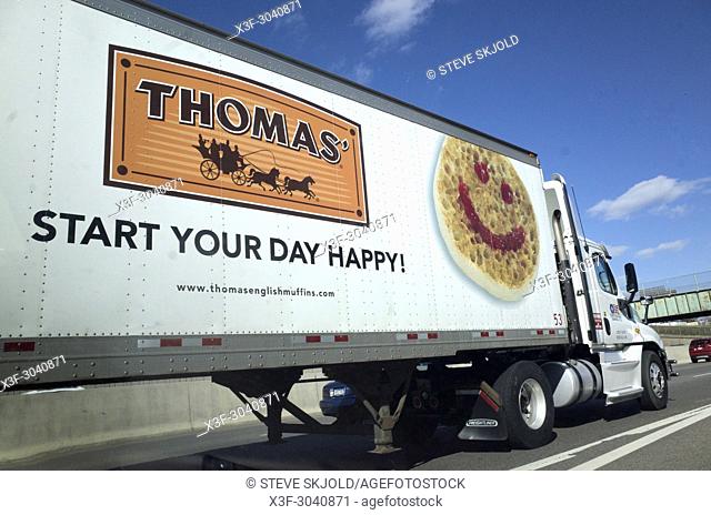 Grinning face emoji on side of Thomas 16 wheel semi truck with the motto: ""Start your day happy"". Minneapolis Minnesota MN USA