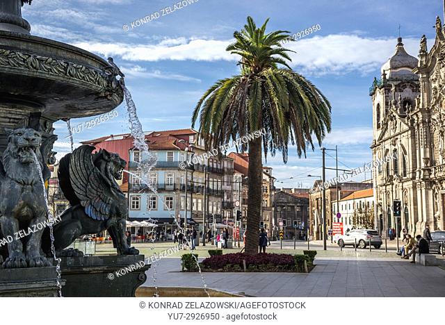 Fountain on Lion's Square in Vitoria parish of Porto city, second largest city in Portugal. Carmelite Church and Carmo churches on background