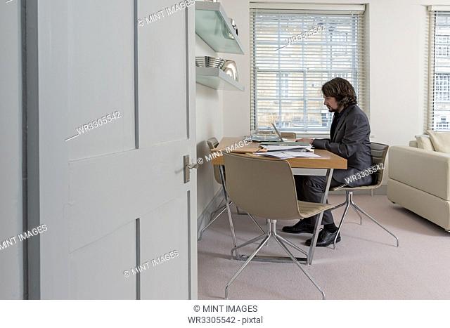 Caucasian businessman working at home office