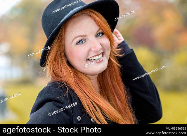 Portrait of a young woman with hat