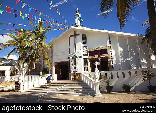 Man in front of the Iglesia De La Inmaculada Concepcion church at the town center, Isla Mujeres, Cancun, Quintana Roo, Mexico, Central America