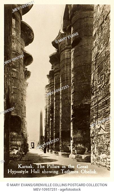 Karnak Temple Complex, Egypt - Pillars of the Hypostyle Hall and distant view of the Obelisk of Thutmosis I