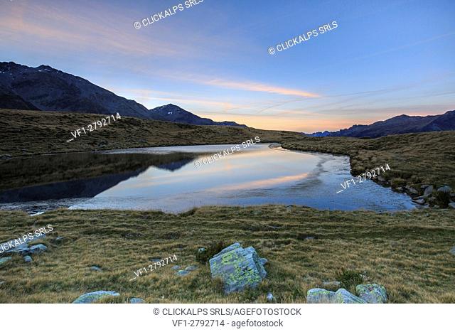 Autumnal view of Lake Andossi at sunrise Chiavenna Valley Spluga Valley Valtellina Lombardy Italy Europe