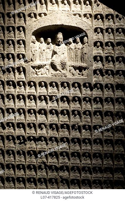Rock slab carved with hundreds of Buddhas. Shanghai Museum. Shanghai. China