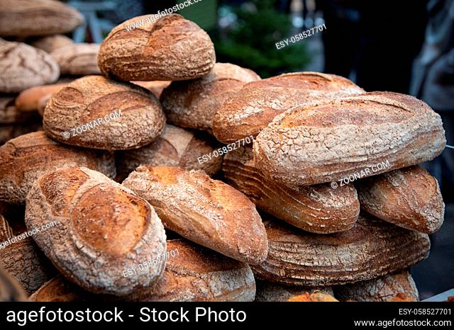 Fresh baked healthy breads on a table of a bakery