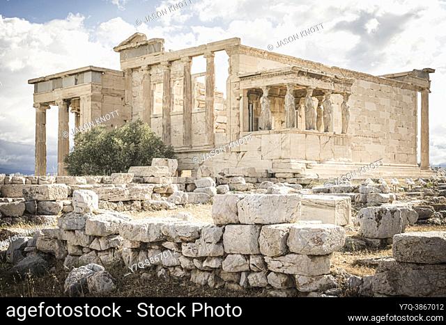 The Porch of the Caryatids and Erechtheion behind the stone ruins of the old Temple of Athena, Acropolis, Athens, Greece