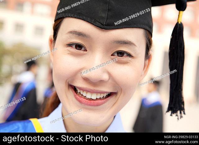 Young Female Graduate Smiling, Close Up