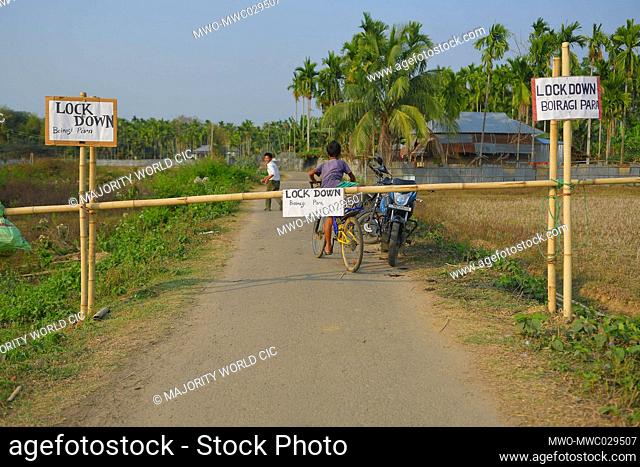 AGARTALA, TRIPURA, INDIA, 27-03-2020 :People are crossing the bars , to enter  , the Bairagi Para ADC Villages , as the people of Bairagi Para , have decided