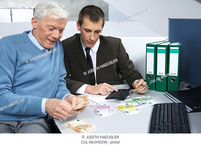Colleagues counting money