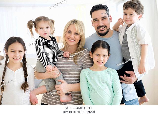 Caucasian parents and children smiling