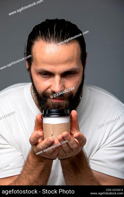 Bearded Man With Pleasure Inhaling The Smell Of Coffee. Guy Drinks Coffee From Cup