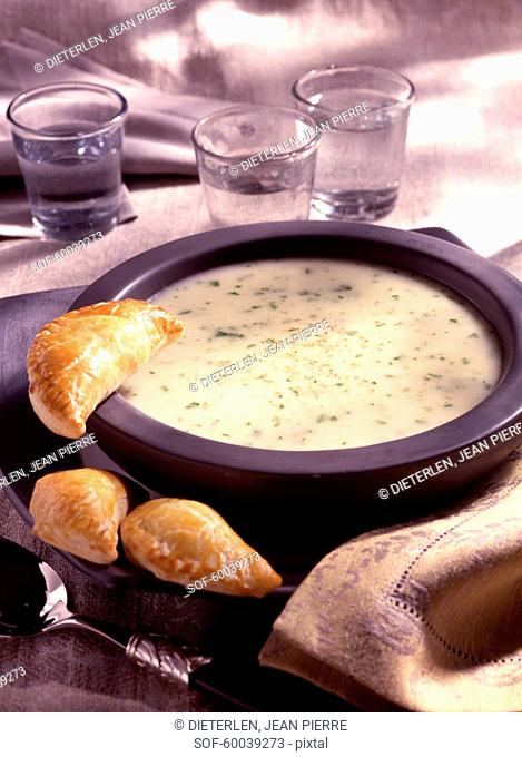Cream of leek and garlic soup with pirojkis