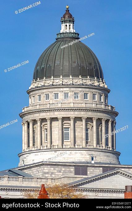 Dome of the Utah State capital building in Salt Lake City Utah with blue sky behind. on a very clear day with no clouds. The capital building is evenly lit