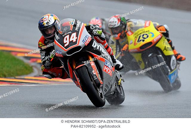 The German Moto2 riders Jonas Folger from Dynavolt Intact GP team and the Spanish Moto2 rider Alex Rins from Paginas Amarillas HP 40 Team during the Motorcycle...