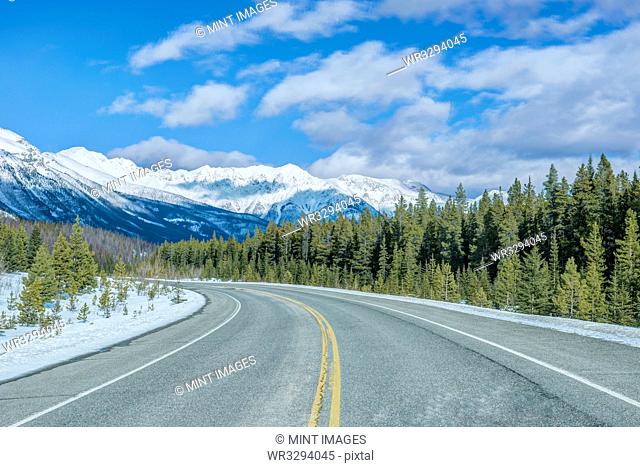 Road leading to snowy mountains
