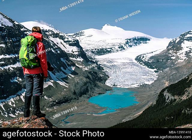 hiker in front of the athabasca glacier