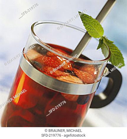 Vitamin-rich berry punch in glass with mint leaves
