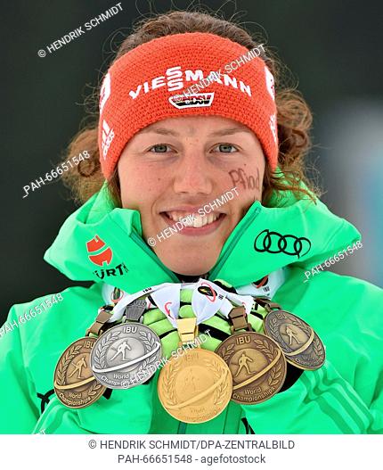 Female Biathlete Laura Dahlmeier of Germany shows her five medals after the Women 12.5km Mass Start competition at the Biathlon World Championships