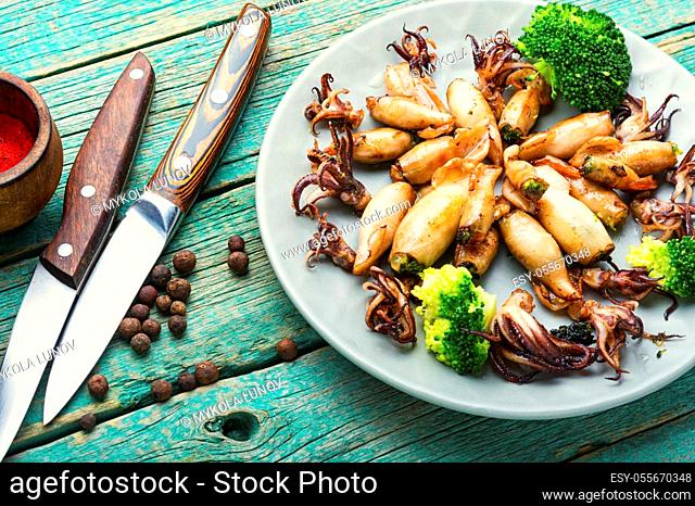 Squid stuffed with broccoli and mushrooms on a plate