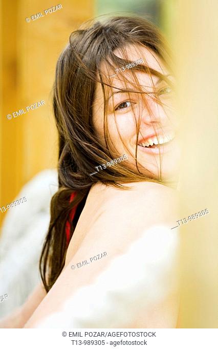 Smiling attractive young woman portrait with untidy hair
