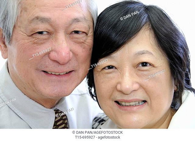 Portrait of senior asian couple in business attire