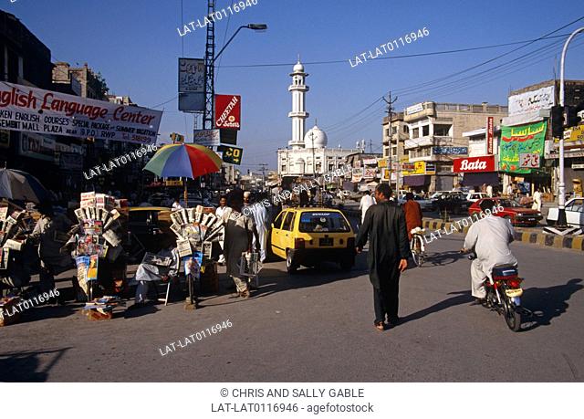 Saddar Bazaar area. Street. Market. Car. Rickshaw. Mosque