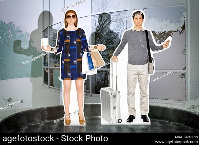 Man and woman standing in front of a glass building, shopping bags and suitcases in hand, cell phone, coffee to go, sunglasses, silver background, still life