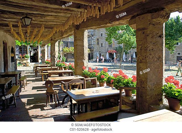 Outdoor café and Place de la Halle main square, Pérouges medieval town. Rhône-Alpes, France