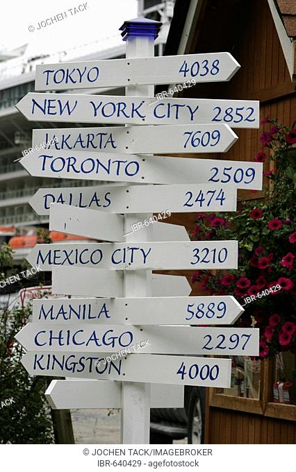 Directional signpost indication distances to cities around the world in Washington, USA, North America
