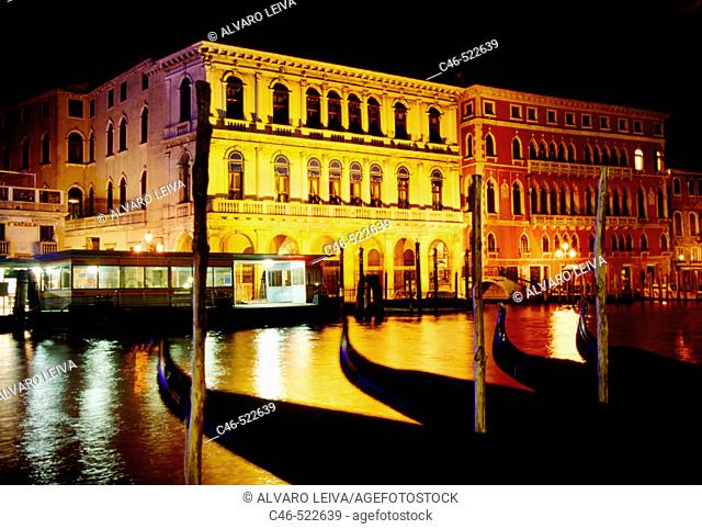 Gondolas on Grand Canal, the palazzo Dolfin Manin on the left and Palazzo Bembo on the right Venice. Veneto, Italy