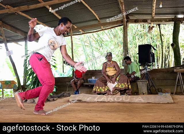 01 May 2022, France, Gros-Morne: Renaud Bonard dances for the visitors in the community hut ""Lakou A"". Photo: Sebastian Kahnert/dpa