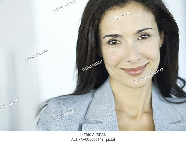 Businesswoman smiling at camera, portrait