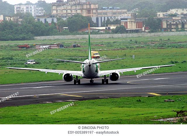 Commercial plane on runway ready for take off at Sahar airport or Chhatrapati Shivaji International airport in Bombay Mumbai ; Maharashtra ; India