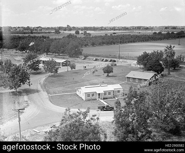 Entrance to camp showing clinic, Farmersville, California, 1939. Creator: Dorothea Lange