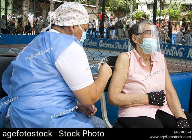 CARACAS, VENEZUELA - JUNE 7: A nurse injects a person a Covid-19 dose, inside sporty of the colony January 23, during Massive day of vaccination program against...