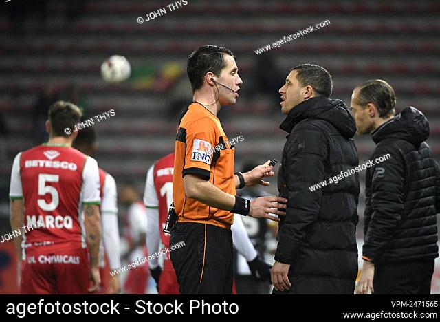 referee Jasper Vergoote, talks with, Charleroi's head coach Karim Belhocine and during a soccer match between Sporting Charleroi and Zulte Waregem