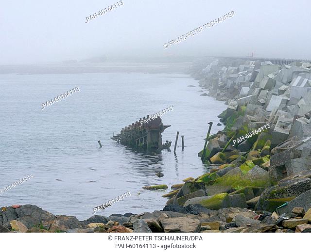 Rusty ship hulls protrude from the water in Scapa Flow on the Orkney Islands, Britain, 16 June 2014. Ships of the British navy were blocking the access area to...