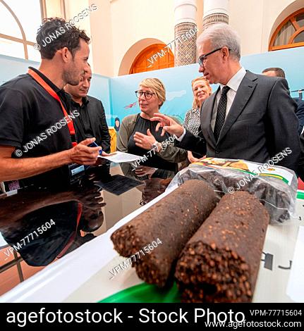 Official envoy of King Mohammed VI Karim Kassi-Lahlou (R) and Minister for Development Cooperation and Metropolitan Policy Caroline Gennez (C) are pictured...