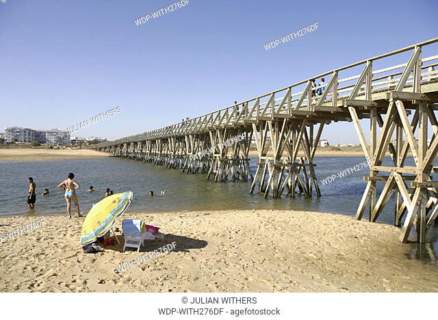 Desternation Spain/Isla Christina wooden bridge leading to the town from the beach