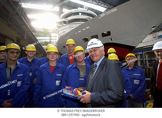 German Foreign Minister, Vice-Chancellor and SPD Chancellor Candidate Frank-Walter Steinmeier standing between trainees while visiting the Meyer-Werft shipyard