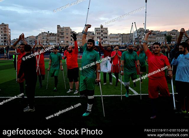 18 November 2022, Syria, Idlib: Foot amputees take part in a football match during the opening of the Idlib city stadium by Syrian Salvation Government