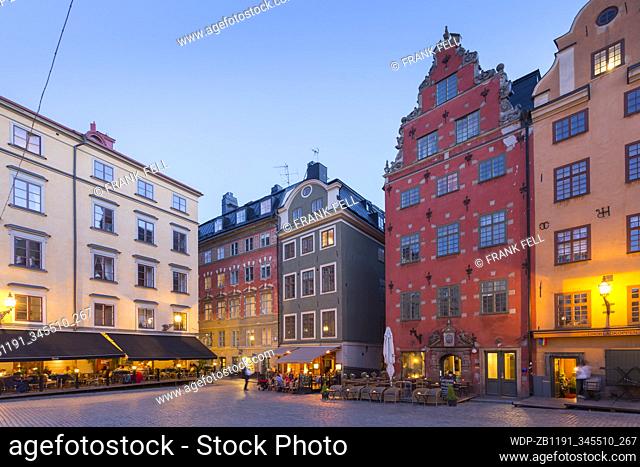 View of colourful buildings on Stortorget, Old Town Square in Gamla Stan at dusk, Stockholm, Sweden, Scandinavia, Europe