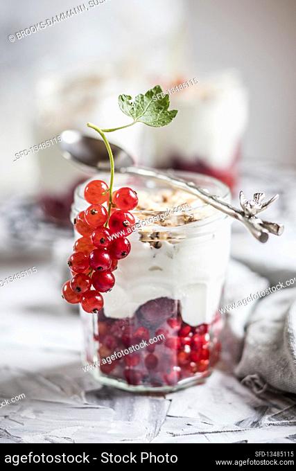 Yogurt parfait with fresh redcurrants and nuts