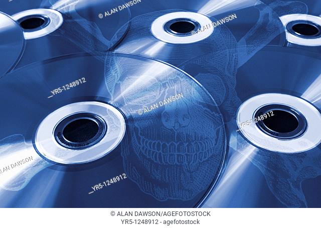 Compact discs with skull and crossbones overlayed  Concept image depicting pirate CD's