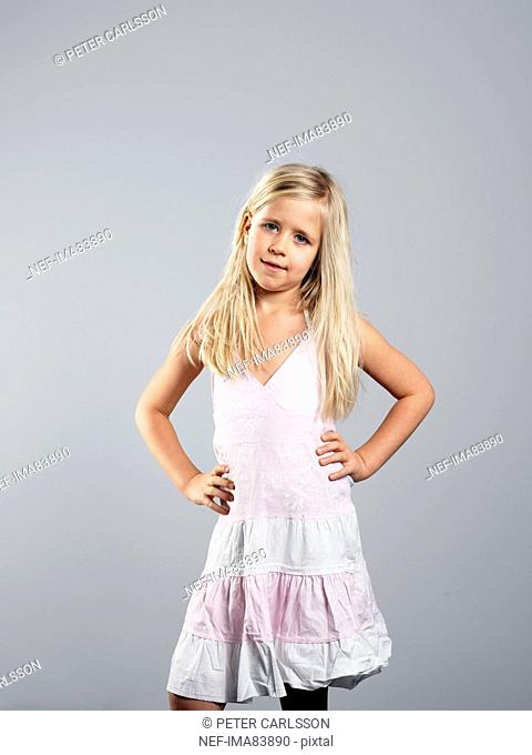 Girl posing against grey background