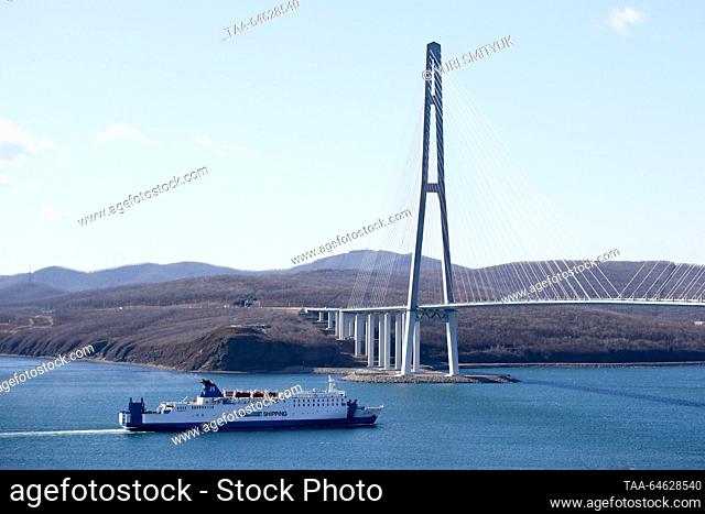 RUSSIA, VLADIVOSTOK - NOVEMBER 10, 2023: The Oriental Pearl VI ro-ro passenger ferry passes under Russky Bridge across the Eastern Bosphorus on her first trial...